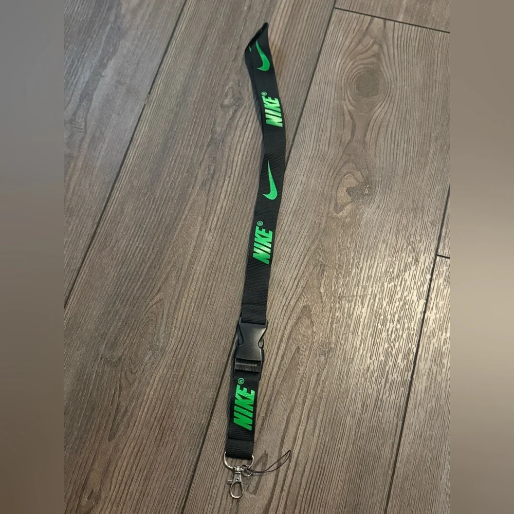 Black Nike Lanyard with Green Lettering